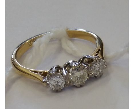 An 18ct Gold Three Stone Diamond Ring.