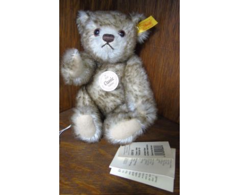 A Classic Steiff Plush Teddy Bear; Reproduction 1926 style with stitched snout, glass eyes, felt pads and jointed body, the b