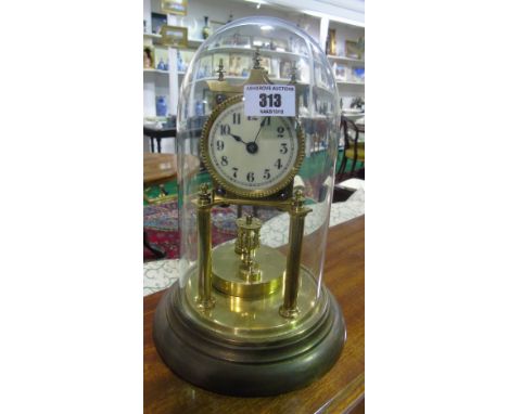 A Brass Anniversary Clock; with a Glass Dome.