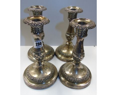 A Set of Four George III Silver Candlesticks; Sheffield 1815, maker Thomas & John Settle, with acanthus decorated nozzles on 