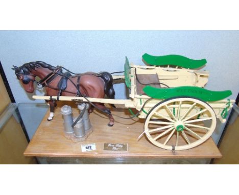 A Beswick Model of a Horse; with a scale model 'Farm Dairy Float', mounted on a wooden plinth, the cart inscribed J W German,