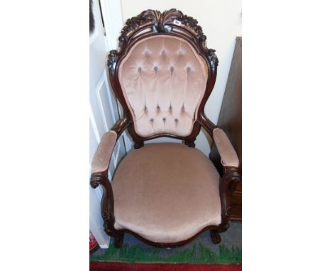 A Victorian Mahogany Button Back Armchair.