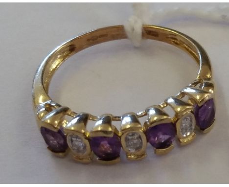 A Gold Ring Set with Diamond & Amethyst.