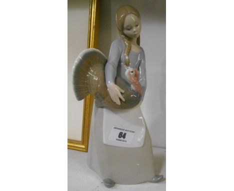 A Lladro Figure of a Girl holding a Turkey.