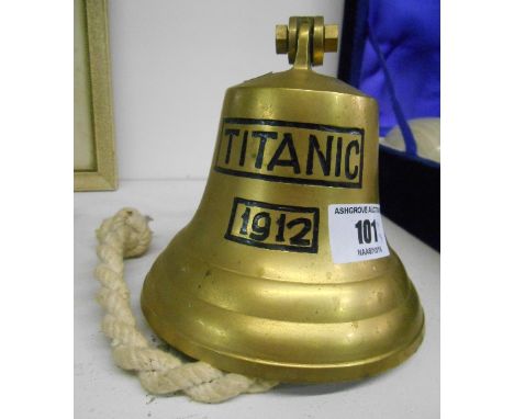 A Decorative 20th Century Reproduction Brass Bell inscribed Titanic 1912. Complete with hanging attachment and knotted rope r