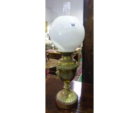 A 19th Century Brass Oil Lamp with milk glass shade.