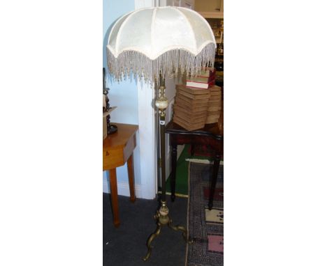 A Brass and Onyx Standard Lamp.