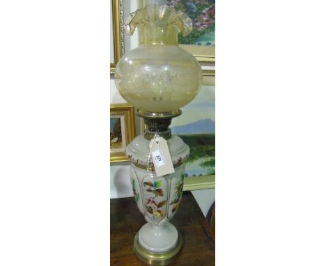 A Late 19th/Early 20th Century Opaque Glass Urn Shaped Oil Lamp; with an enamel decoration of pine cones and hazel nuts, on a