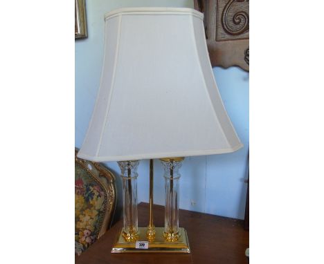 A Brass and Glass Table Lamp, fitted with a cream shade.