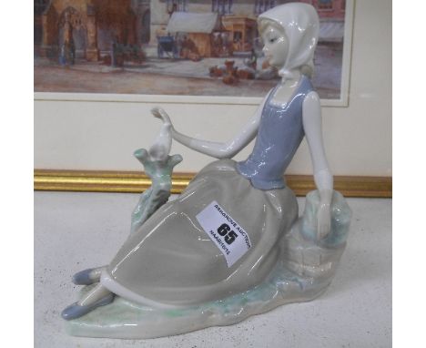 A Lladro Figure of a Girl Looking at a Bird.