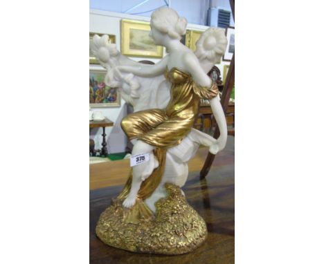 A Gilt Decorated Figure in the Art Nouveau Style, after Louis Beataux, depicting a seated Neo-Classical female surrounded by 