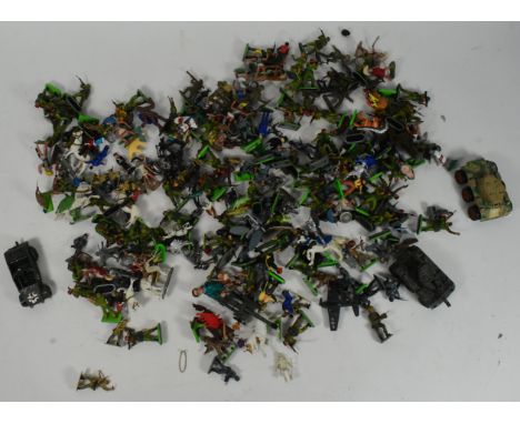 A collection of 20th century military related wild west cowboy toy soldiers and figures to include plastic, tin and pewter ex