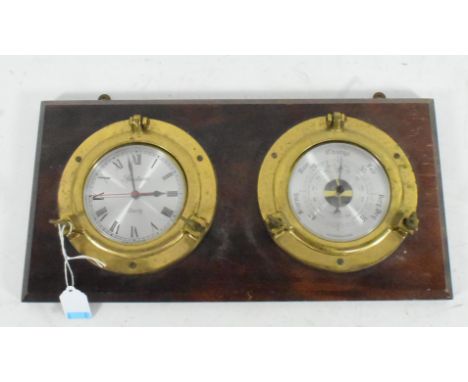 A 20th century quartz movement wall mounted barometer stamped for Spectrum and mounted on mahogany. Measures 38cm length.