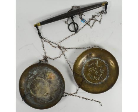 Large vintage Malaysian brass hanging balance / scales. Having two brass baskets hanging via chains from a brass tipped woode