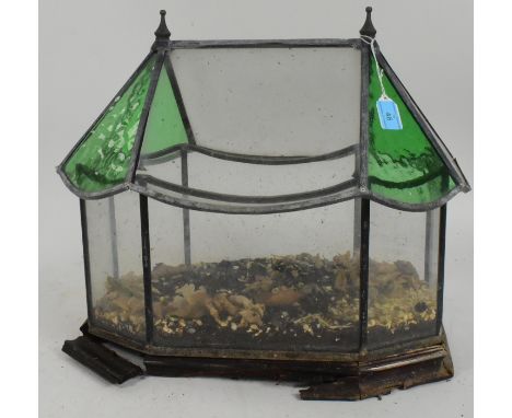 A 20th century stained glass terrarium. The terrarium being of architectural form with wooden base. A/F. Measures approx 42cm