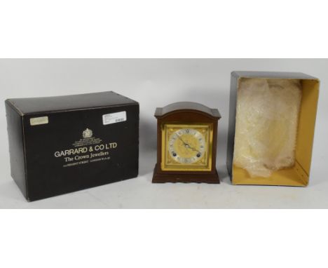 Garrard &amp; Co Elliots - A 20th century reproduction mantel bracket clock. The clock having gilt incised face with silvered