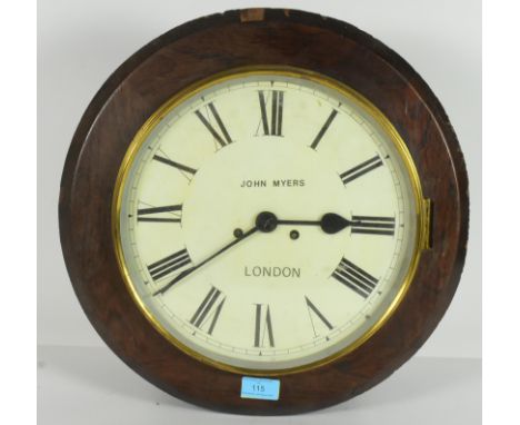 A 19th Century Victorian mahogany circular station wall clock by John Myers of London. The central dial having a white enamel