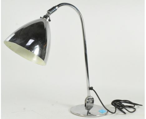 A contemporary chrome 20th century table lamp light. Chrome terraced base with angled upright frame having a shaped UFO space