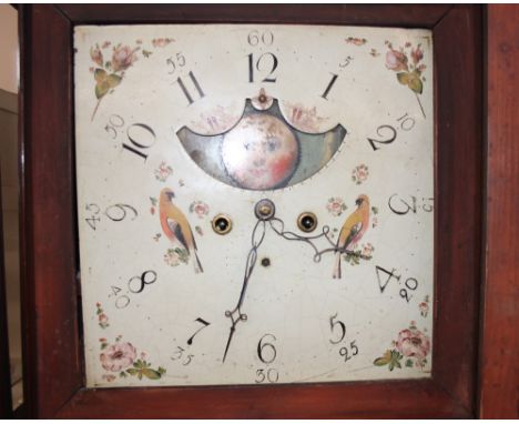 A 19th Century mahogany long case clock, surmounted by a scroll arch pediment enclosing a painted dial with rolling moon face