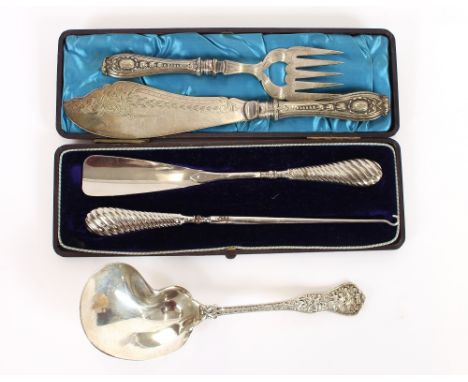 A cased button hook and shoe horn set; a pair of plated fish servers and a fancy continental white metal serving spoon, havin