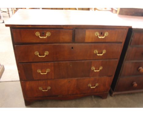 A Georgian walnut and pine sided chest, fitted two short and three long drawers, raised on a shaped apron and bracket feet, 1