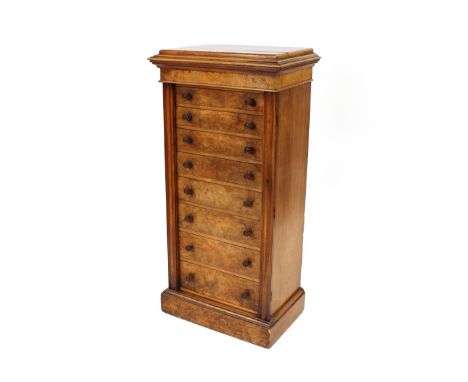 A 19th Century burr walnut Wellington chest, fitted 8 drawers flanked by locking folding side bars and raised on a platform p