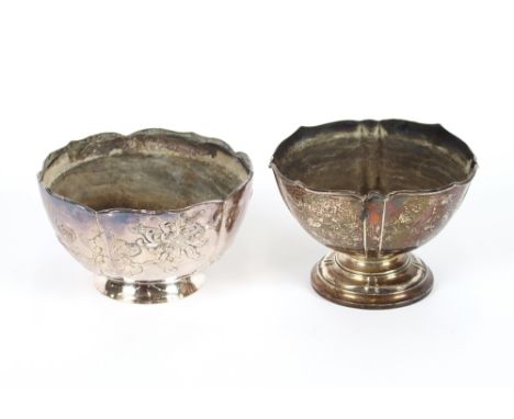 A Chinese white metal rose bowl, with flowerhead decoration beneath a shaped border, raised on a circular spread foot, 16.5cm