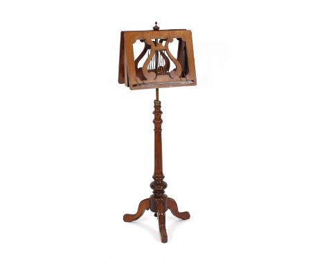 A Victorian mahogany double sided music stand, raised on a turned baluster column and tripod base, 122cm high