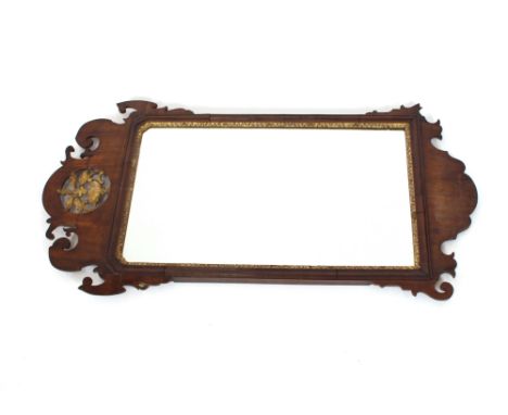 A 19th Century mahogany fret carved Chippendale style wall mirror, the pediment with gilt urn decoration, 94cm x 49cm in extr