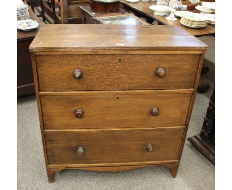 An Antique oak and pitched pine chest, fitted three long drawers, raised on a shaped apron and bracket feet, AF, 88cm wide