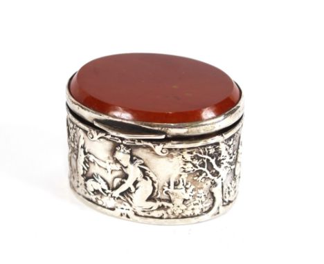 A Dutch silver patch box, having agate lid, the body profusely decorated with rural scenes