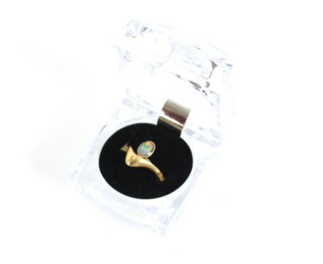 An 18 carat gold opal set wishbone ring