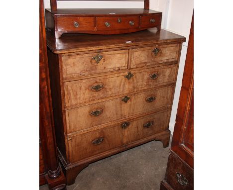 An 18th Century walnut and cross-banded chest, of two short and three long drawers, raised on bracket feet, 105cm wide