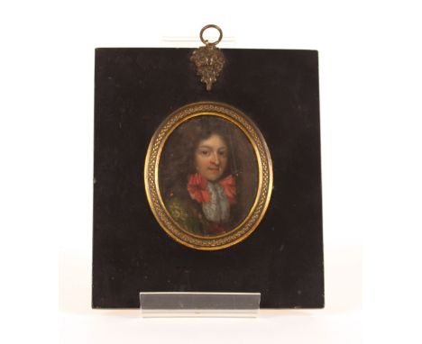 An 18th Century miniature portrait of a young gentleman, with wig and ruffled collar, oil on copper, contained in ebonised an
