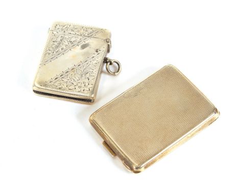 An Edwardian silver Vesta case, with foliate decoration, Chester 1904, and a silver matchbook holder with engine turned decor