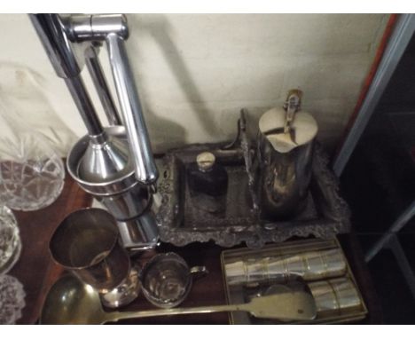 A Tray of Silver Plate to Include Fruit Basket, Hot Water Jug, Hip Flask, Cream Jug, Ladle, Napkin Rings, Goblet, Juicer etc