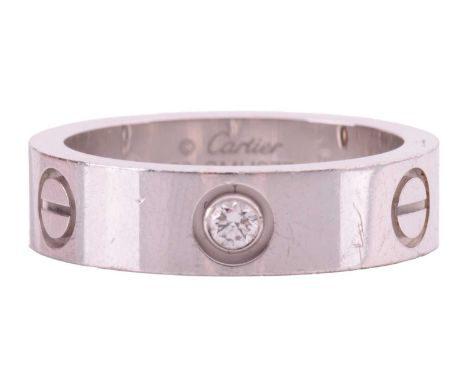 Cartier - an 18ct white gold 'Love' ring with polished band set with three brilliant-cut diamonds, totalling 0.22ct, further 