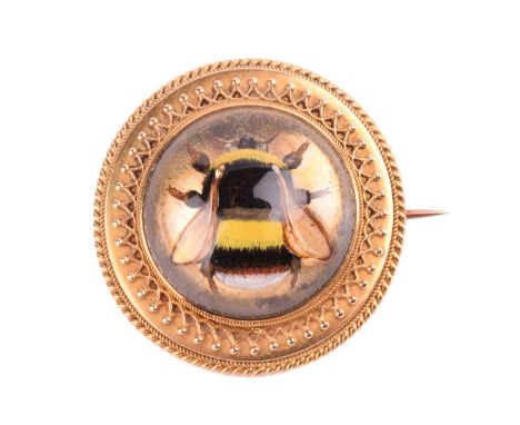 An Essex crystal bee brooch, containing a round rock crystal cabochon with reverse intaglio depicting a bumblebee, collet-set