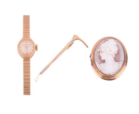 A wristwatch, a riding crop bar brooch and a cameo brooch; the 9ct gold ladies wristwatch features a 17 jewel mechanical move