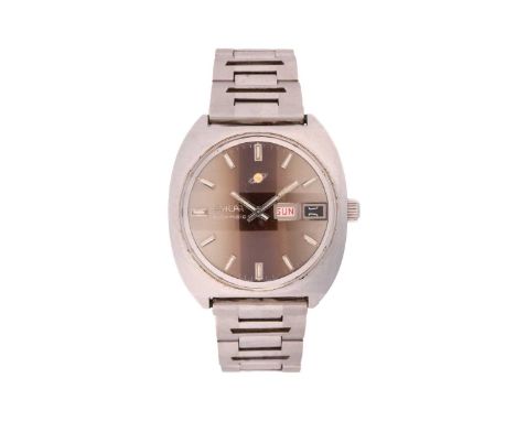 An Enicar Automatic Day date steel watch.Model: 167.01.24Case Material: SteelCase diameter: 37mmDial: BrownNumerals: BatonMov