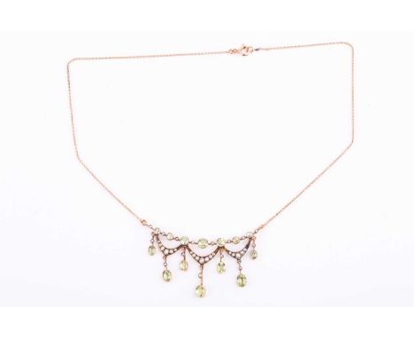 A late Victorian peridot and seed pearl fringe necklace by Birks, set with alternating peridots and seed pearls, with seed pe
