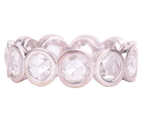 A rose-cut diamond full eternity ring, comprising eleven rose-cut diamonds of 4.8 mm in open-back collets, white metal stampe