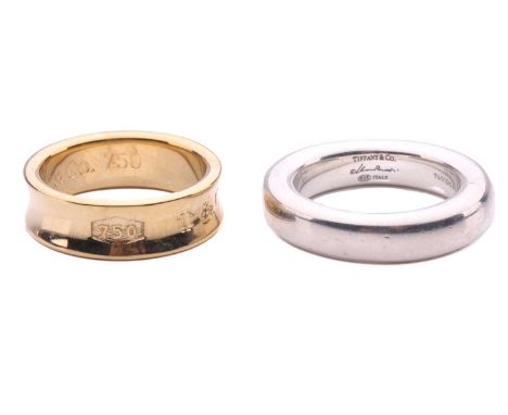 Tiffany &amp; Co. - two ring bands; including a thick 'Donut' ring by Elsa Peretti, with a heavy court-shaped band in silver,