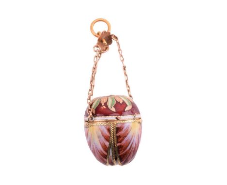 An enamel miniature scent bottle pendant, possibly Austrian, circa 1820s, the egg-shaped outer case with chain suspension is 