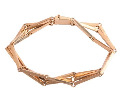 A three-line bar link bracelet, with polished bar links connected with jump rings and fastens with box clasp, yellow metal ma