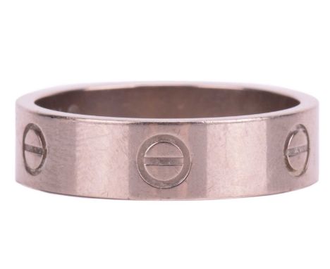Cartier - a 'Love' ring with polished white metal band, decorated with screw head motifs, signed and numbered, 6.0 mm wide, r