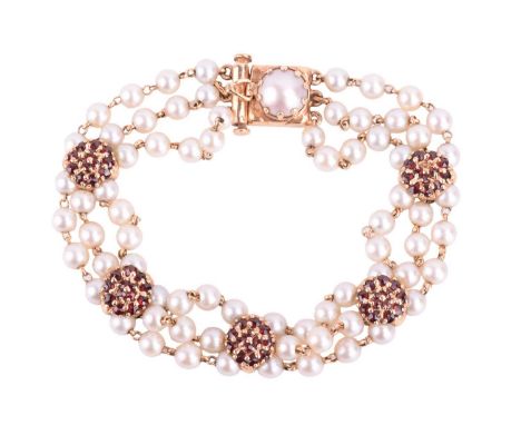 Lucien Piccard - a cultured pearl and garnet bracelet, comprising three rows of individually linked round pearls with silver 