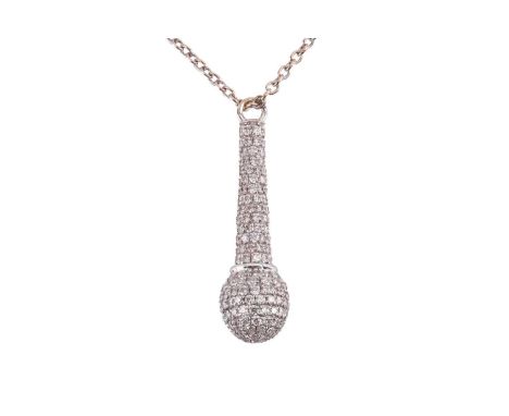 A diamond set microphone pendant and chain in white metal tested as 18ct gold, featuring a microphone pendant measuring 3cm l