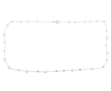 A cultured pearl and diamond chain necklace, comprising a series of cable link segments, interspaced with eleven cream-colour