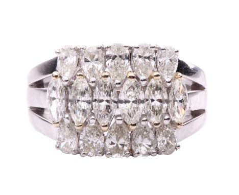 A diamond dress ring, featuring three rows of marquise shape and pear shape diamonds in claw settings, with a total estimated